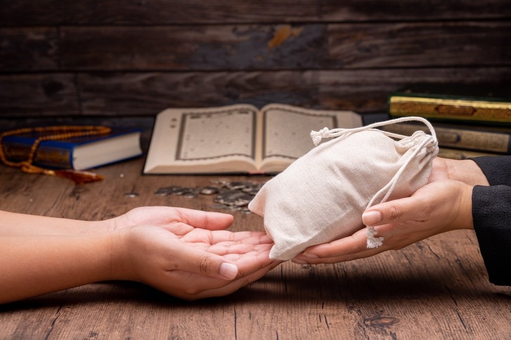 Ramadan,,Hands,Holding,A,Money,Bag,For,Zakat,,Islamic,Zakat